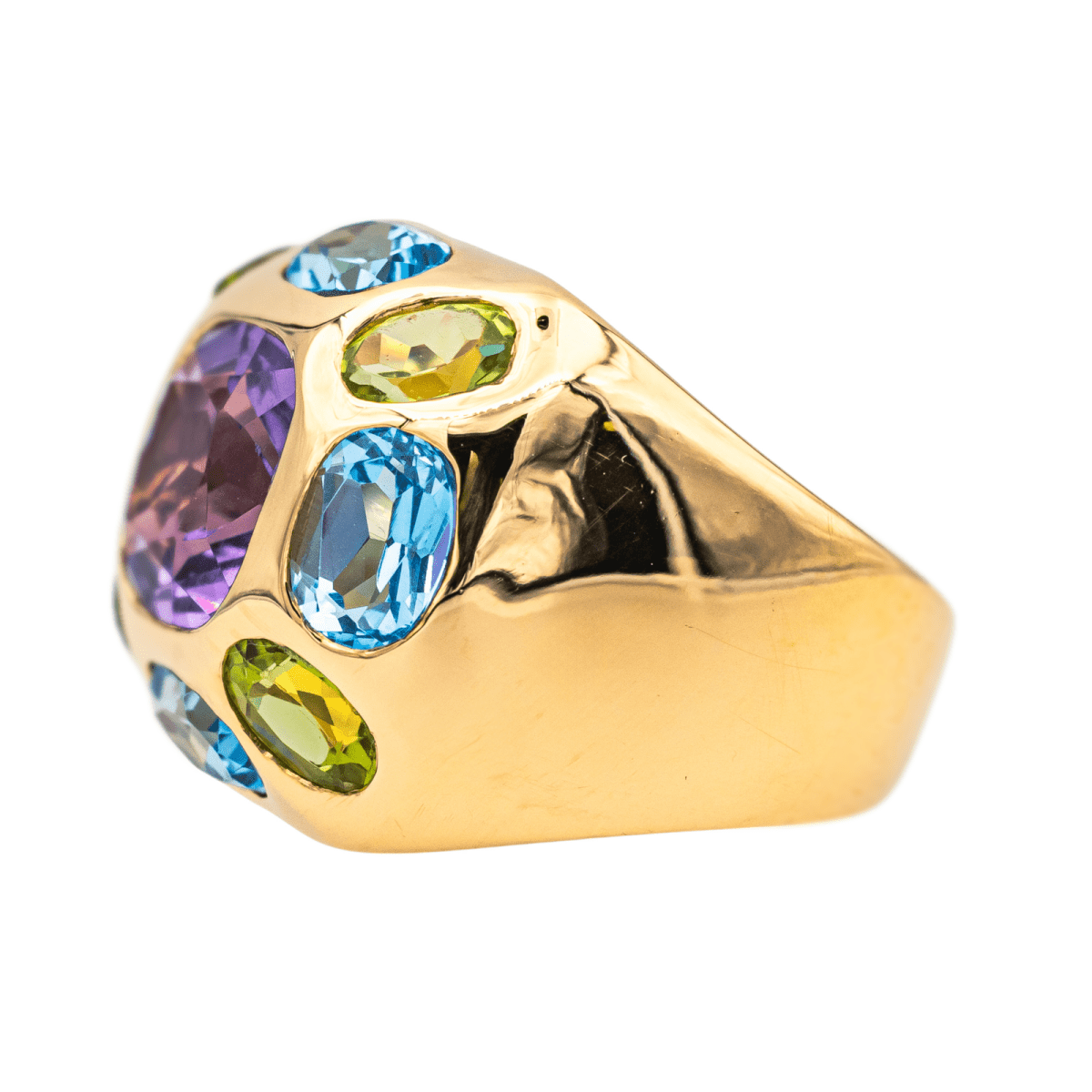 Bague Cocktail en or jaune, améthyste, péridots et topaze - Castafiore