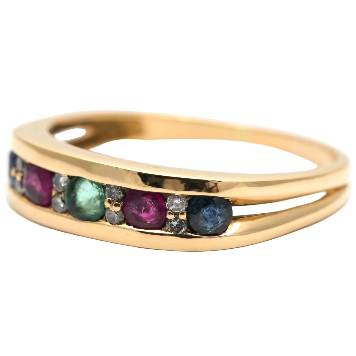 Bague en or jaune, émeraude, rubis, saphirs et diamants - Castafiore