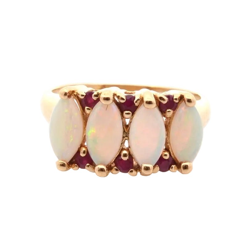 Bague en or jaune, opales et rubis - Castafiore