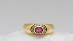 Bague en or jaune, rubis et diamants - Castafiore