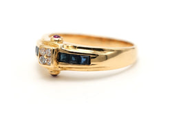 Bague en or jaune, saphirs, rubis et diamants - Castafiore