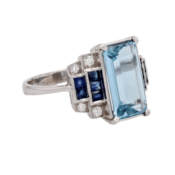Bague Entourage en or blanc, aigue - marine, saphirs et diamants - Castafiore