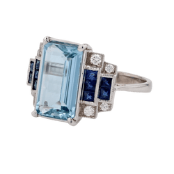 Bague Entourage en or blanc, aigue - marine, saphirs et diamants - Castafiore