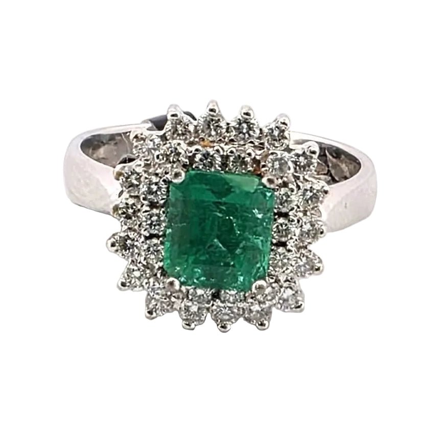 Bague Entourage en or blanc, émeraude et diamants - Castafiore