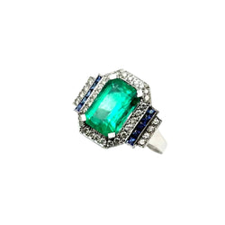 Bague Entourage en or blanc, émeraude, saphirs et diamants - Castafiore