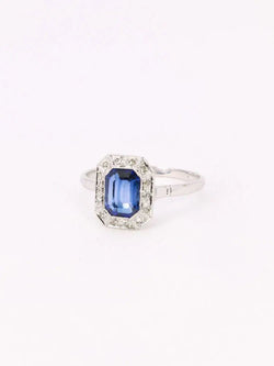 Bague Entourage en or blanc, platine, pierre bleue et diamants - Castafiore
