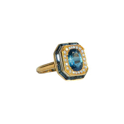 Bague Entourage en or jaune, pierre bleue et diamants - Castafiore