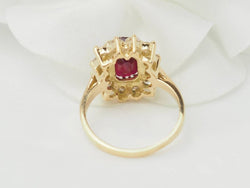 Bague entourage en or jaune rubis et diamants - Castafiore