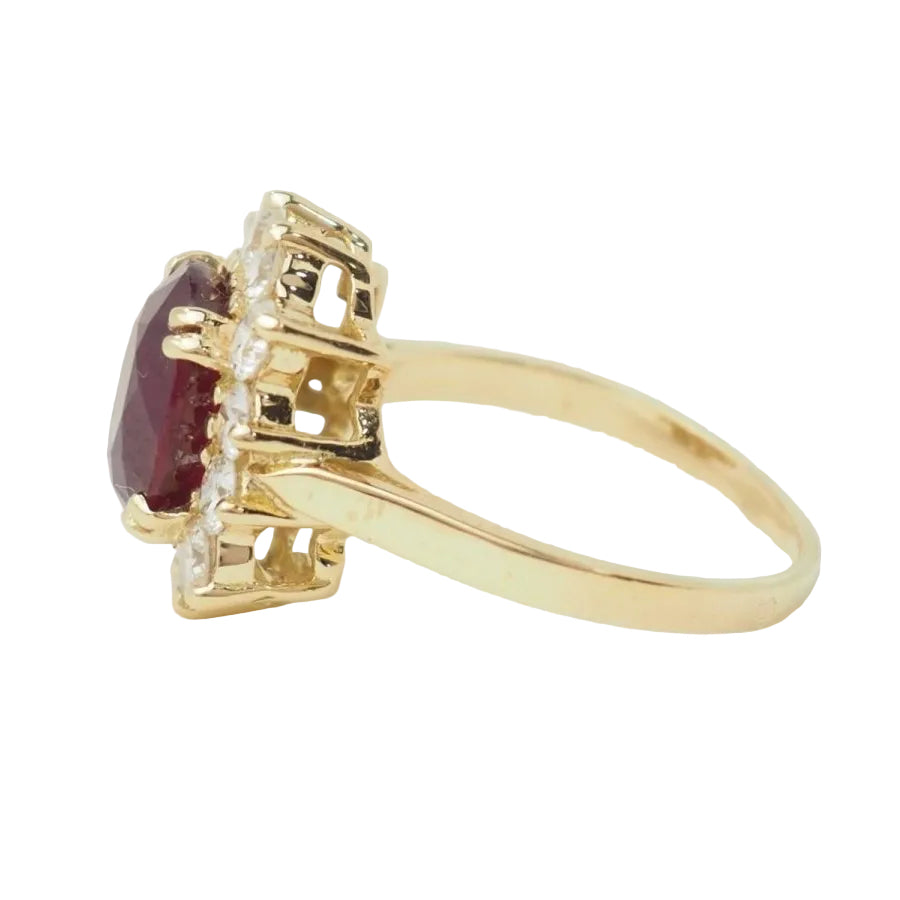 Bague entourage en or jaune rubis et diamants - Castafiore
