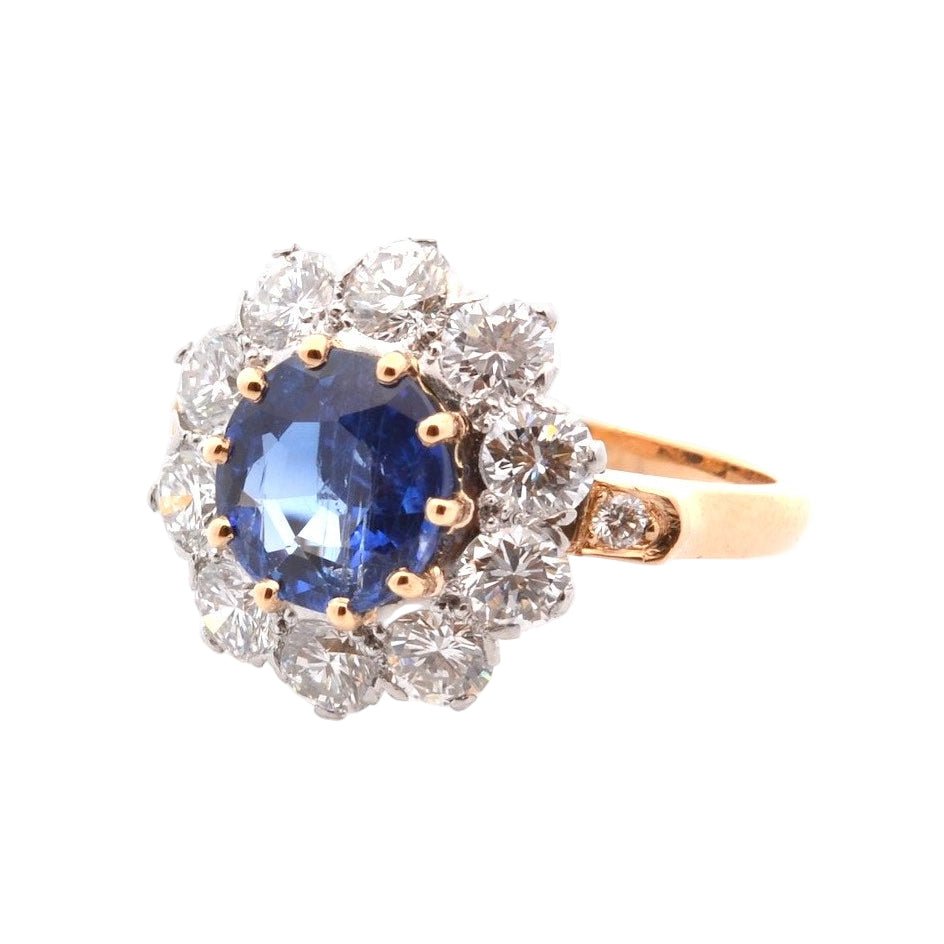 Bague Entourage en platine, or, saphir, et diamants - Castafiore