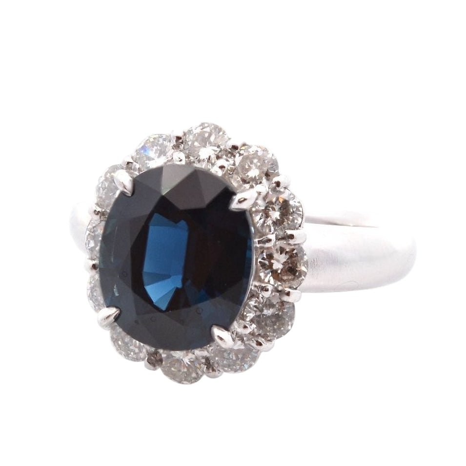 Bague Entourage en platine, saphir et diamants - Castafiore