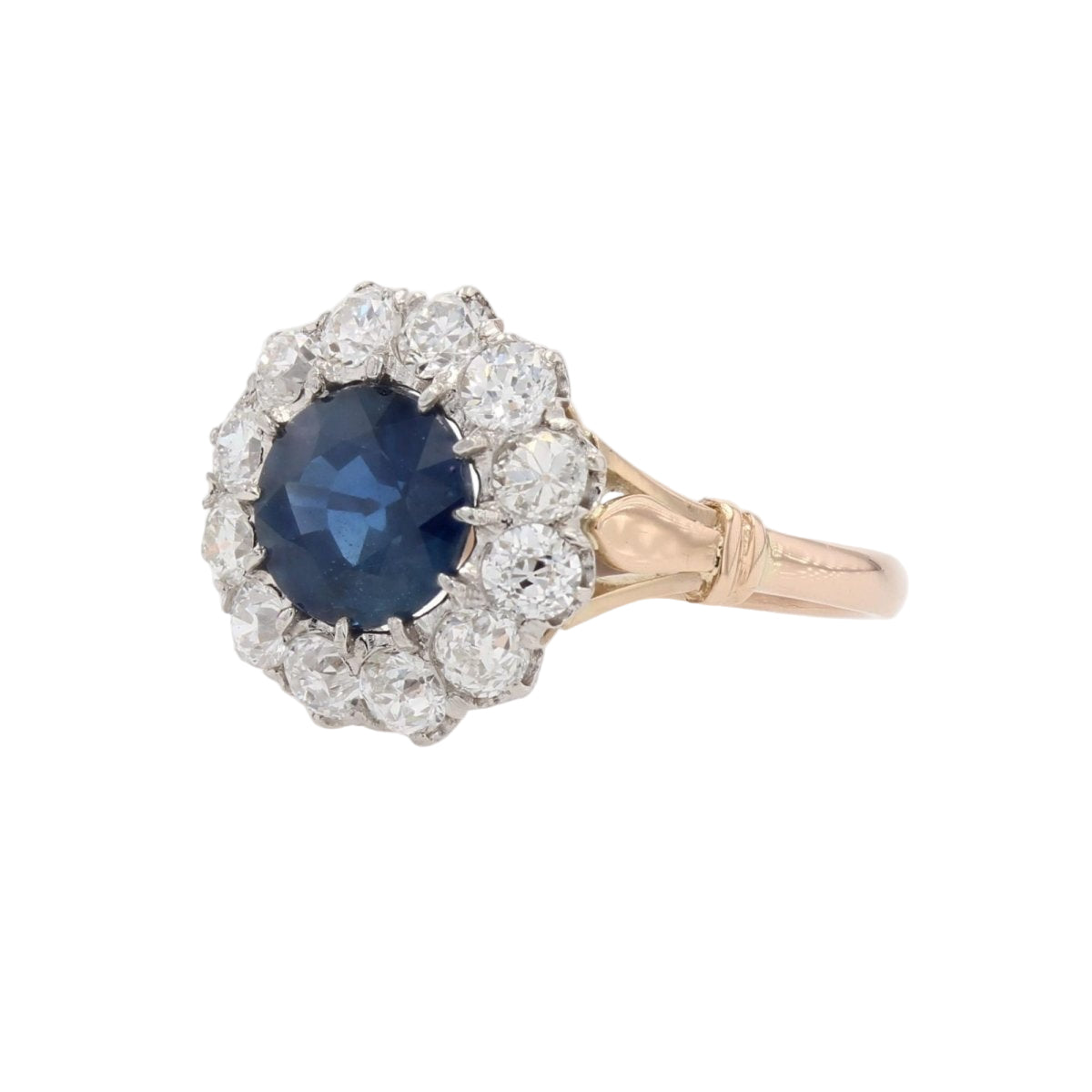 Bague marguerite ancienne en or rose et platine avec saphir et diamants - Castafiore