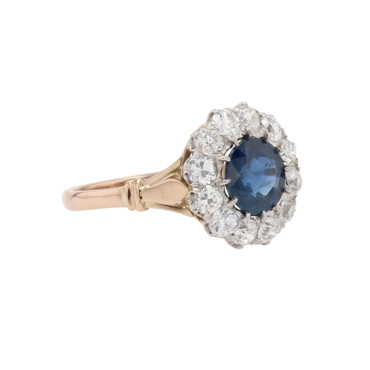Bague marguerite ancienne en or rose et platine avec saphir et diamants - Castafiore