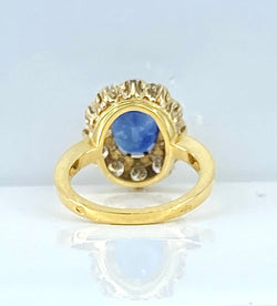 Bague marguerite en or 18 carats, saphir 3,50 carats et diamants - Castafiore