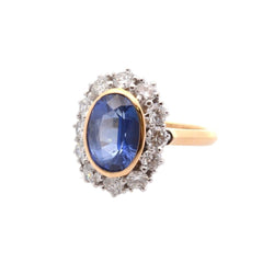 Bague Marguerite en or jaune, platine, saphir, et diamants - Castafiore