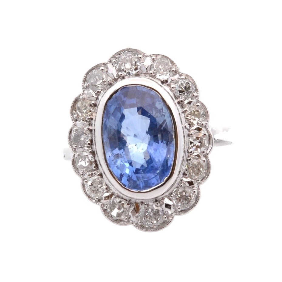 Bague Marguerite en platine, or jaune, saphir, et diamants - Castafiore