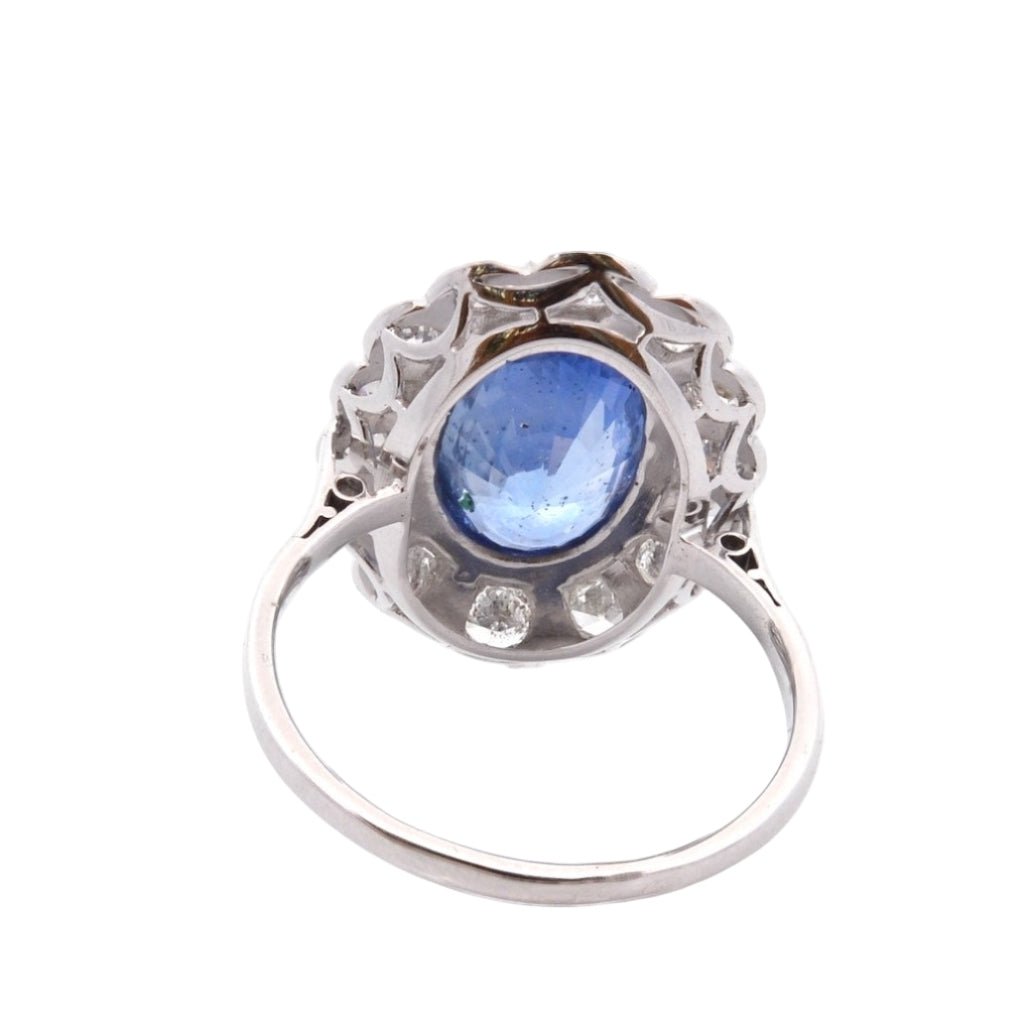 Bague Marguerite en platine, or jaune, saphir, et diamants - Castafiore