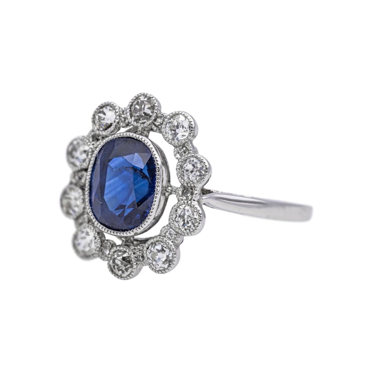 Bague Marguerite en platine, saphir et diamants - Castafiore