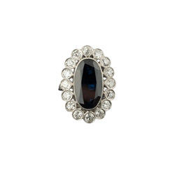 Bague marguerite en platine, saphir et diamants. - Castafiore