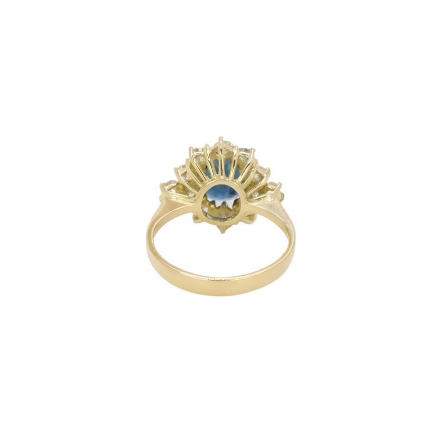 Bague marguerite vintage en or, saphir ovale et diamants - Castafiore