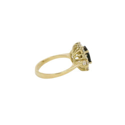 Bague marguerite vintage en or, saphir ovale et diamants - Castafiore