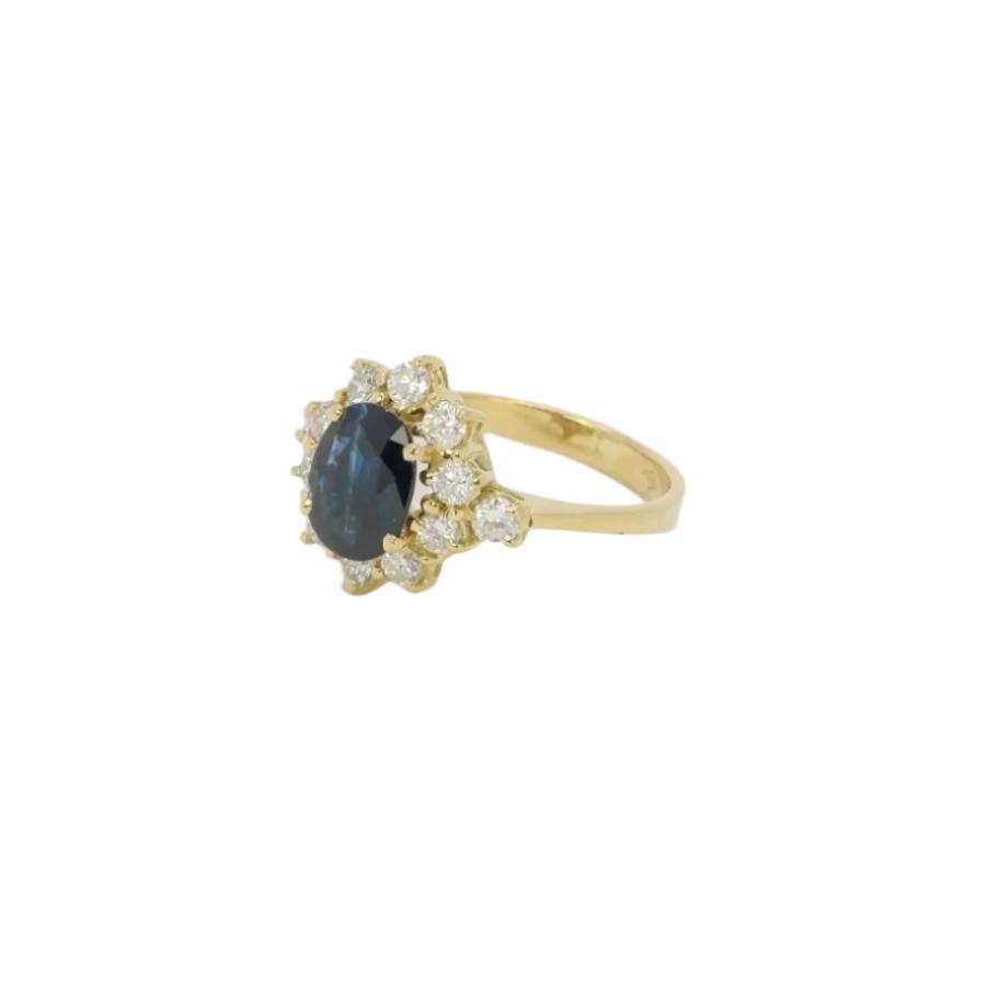 Bague marguerite vintage en or, saphir ovale et diamants - Castafiore