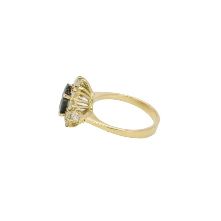 Bague marguerite vintage en or, saphir ovale et diamants - Castafiore