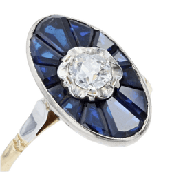 Bague Marquise en or jaune, or blanc, saphirs et diamant - Castafiore