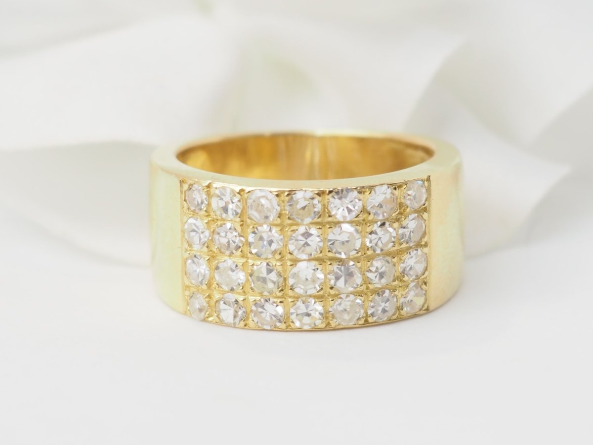 Bague ruban en or jaune et diamants - Castafiore