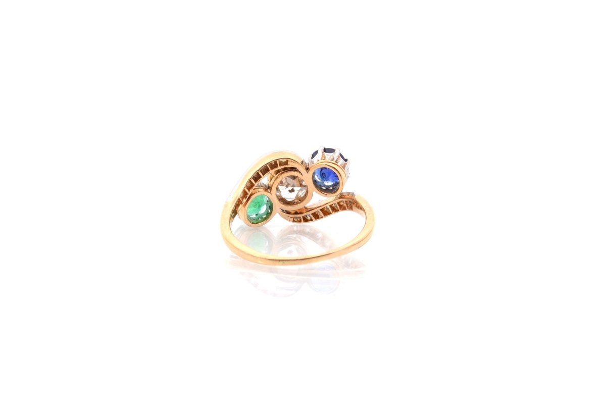 Bague trilogie en or jaune, platine, saphir, émeraude et diamants - Castafiore