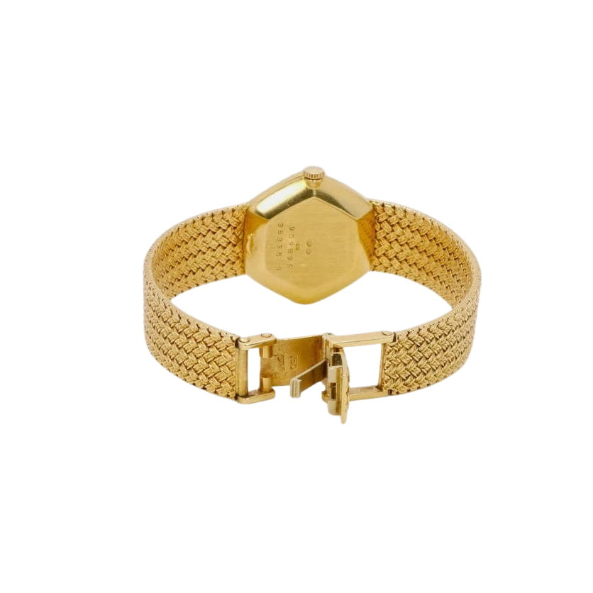 BAUME & MERCIER Montre vintage or jaune maille tressée - Castafiore