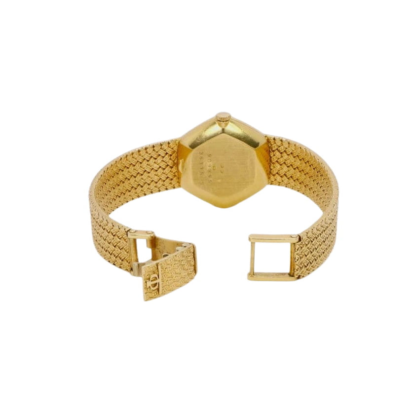 BAUME & MERCIER Montre vintage or jaune maille tressée - Castafiore