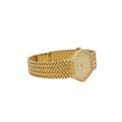 BAUME & MERCIER Montre vintage or jaune maille tressée - Castafiore