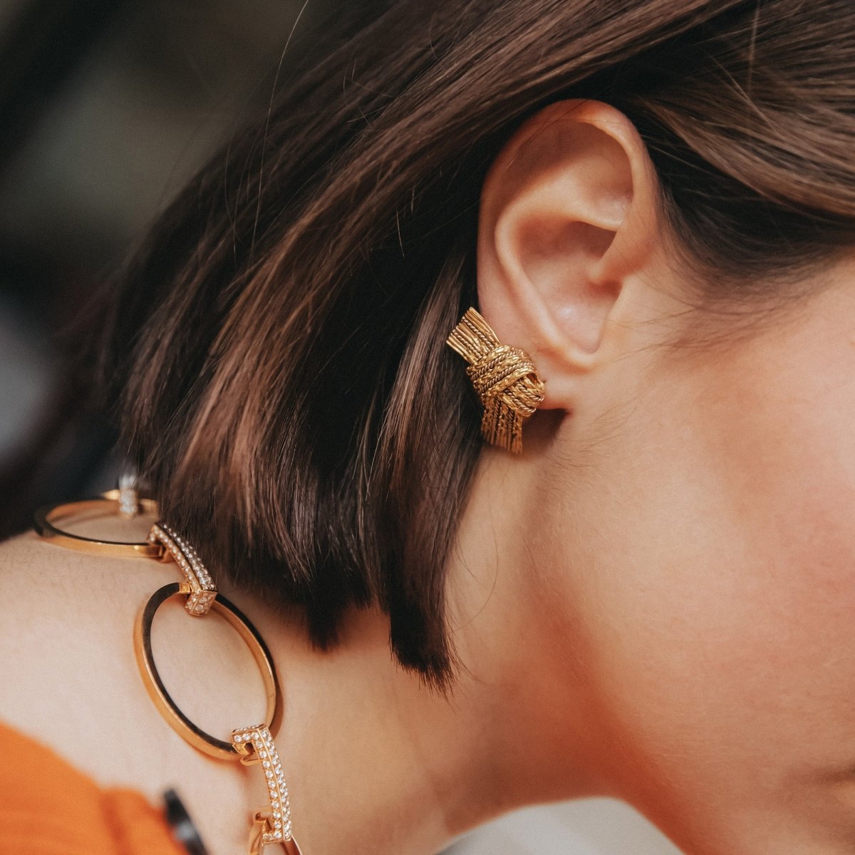 Boucles d'oreilles Clip HERMÈS Nœud en or jaune et or blanc