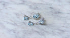 Boucles d'oreilles Gouttes Topaze Bleue et Diamant sur Or Blanc - Castafiore