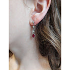 Boucles d'oreilles Pendantes en or blanc, rubis, et diamants - Castafiore