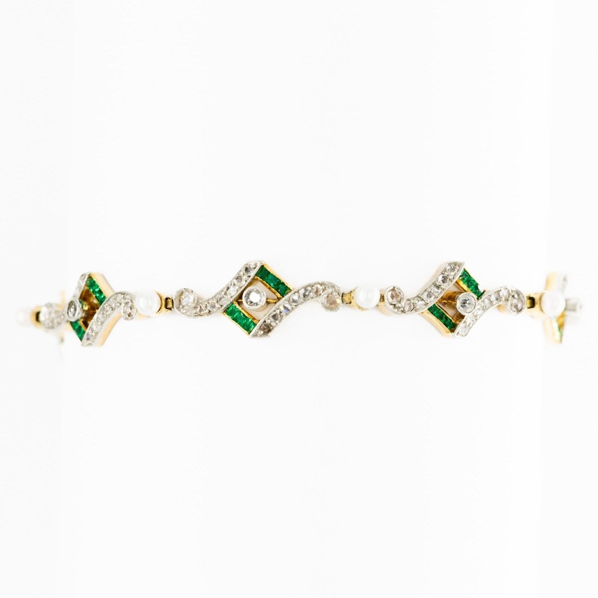 Bracelet Art Deco en or jaune, platine, perles, émeraudes et diamants - Castafiore