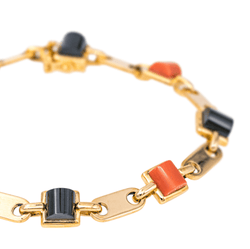 Bracelet CARTIER en or jaune, onyx et corail - Castafiore