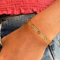 Bracelet CARTIER "Love" Modèle Classique Pavé en or rose et diamants - Castafiore