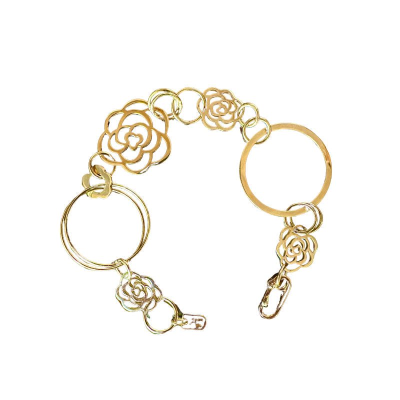 Bracelet CHANEL "Camélia" en or jaune - Castafiore