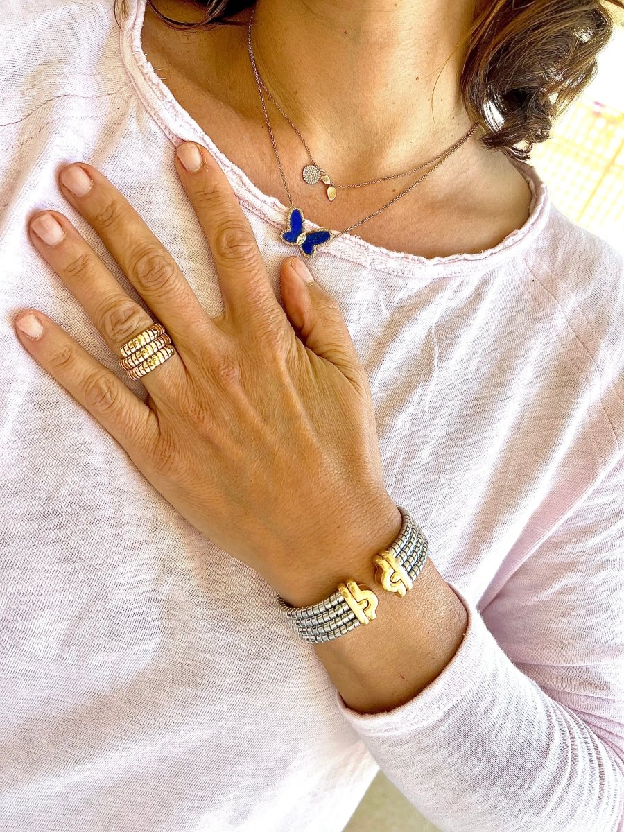 Bracelet de la Maison Bvlgari,collection Parentesi en acier et or jaune - Castafiore