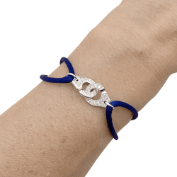 Bracelet DINH VAN "Menottes R10" en or blanc et diamants - Castafiore