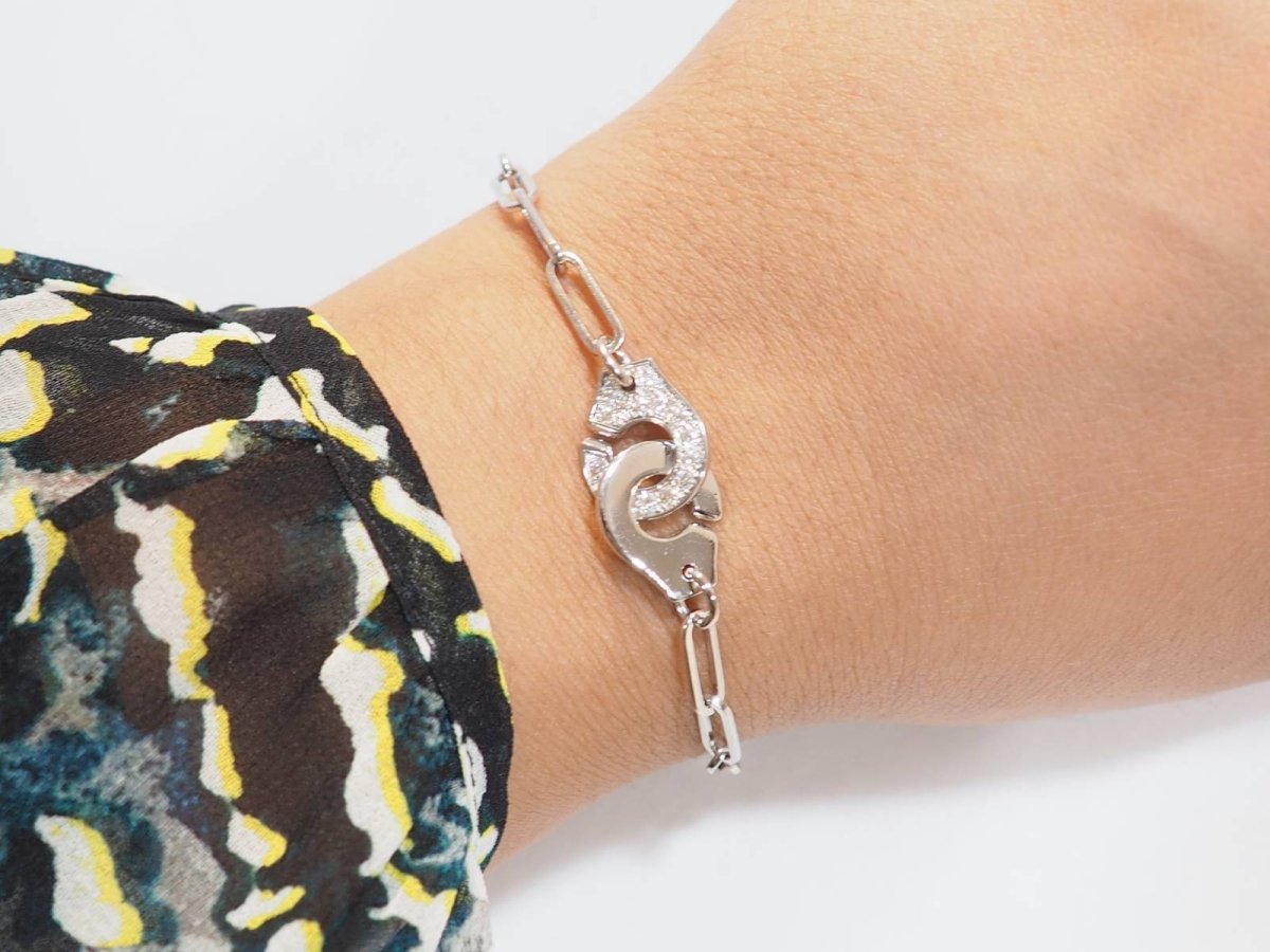 Bracelet DINH VAN Menottes R12 en or blanc et diamants - Castafiore