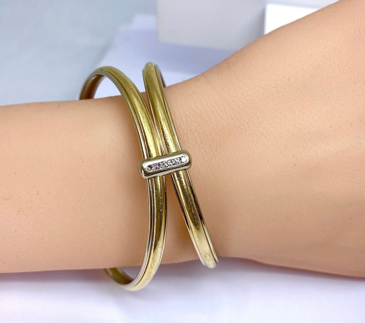 Bracelet double joncs or 18 carats, diamants, Yves Saint Laurent