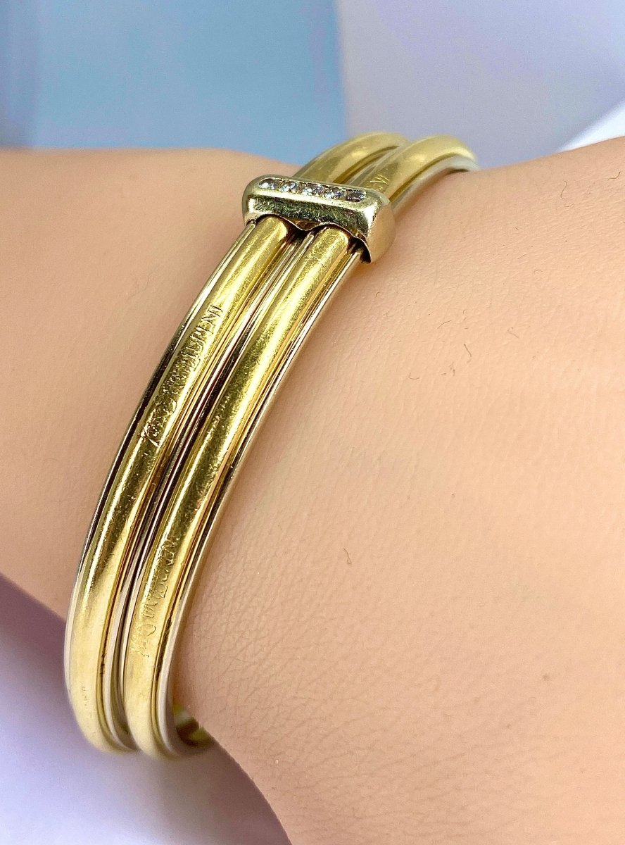 Bracelet double joncs or 18 carats, diamants, Yves Saint Laurent - Castafiore