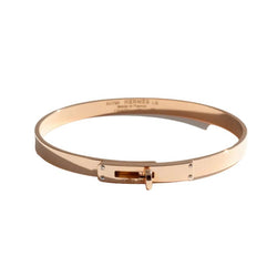 Bracelet Jonc HERMÈS "Kelly" PM en or rose et diamants - Castafiore