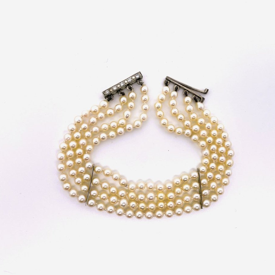 Bracelet Souple 4 rangs de perles blanches or blanc et diamants - Castafiore