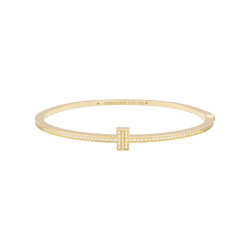 Bracelet Tiffany & Co., "Tiffany T" en or jaune et diamants. - Castafiore
