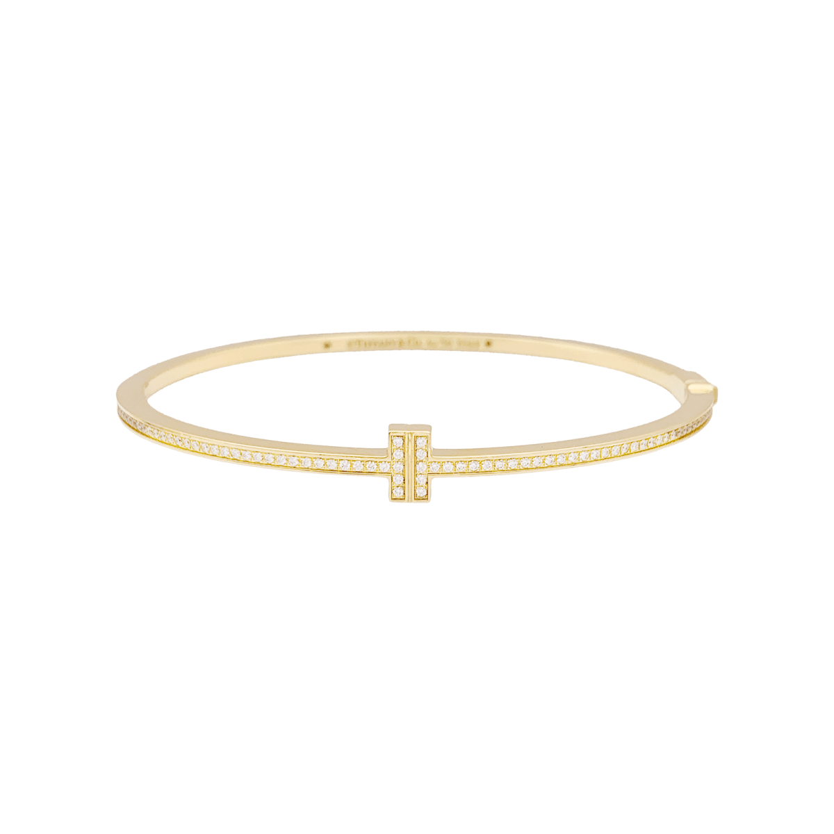 Bracelet Tiffany & Co., "Tiffany T" en or jaune et diamants. - Castafiore
