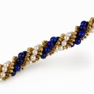 Bracelet VCA "Twist" en or jaune, perles et lapis - lazuli - Castafiore